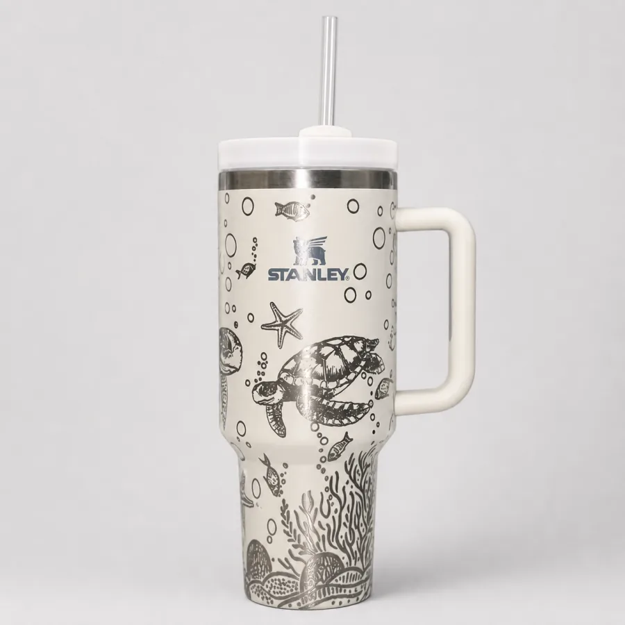 White handled tumbler engraved with a detailed sea turtle and underwater full-wrap design